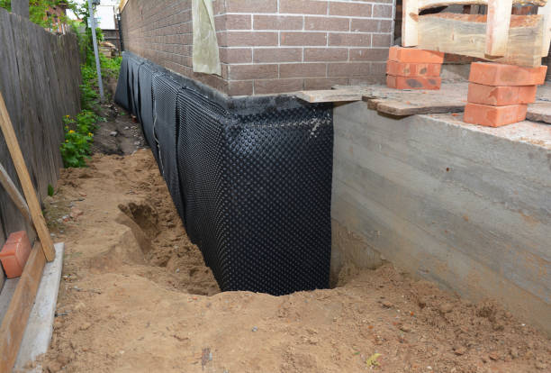 Happy homeowners after waterproofing job in Dowling
